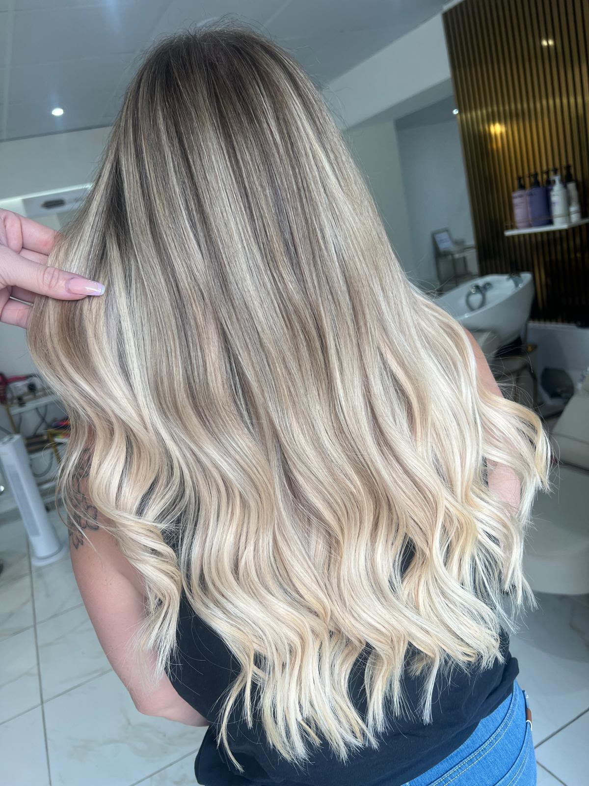 Blonde balayage cut and styling finished at Dolly Rocks
